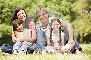 Family outdoors smiling