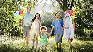 Family In Outdoors Walking Towards A Camera