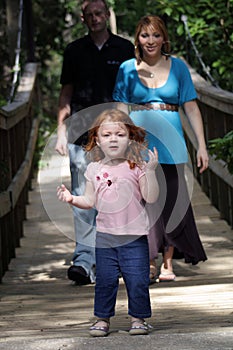 Family Outdoors on a Wooden Foot Bridge (2) photo
