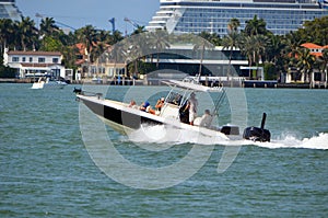 Family Outing in a Speeding Open Sport Fishing Boat