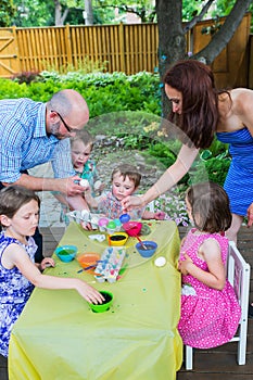 Family Painting and Dyeing Easter Eggs Together