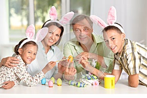 Family painting Easter eggs