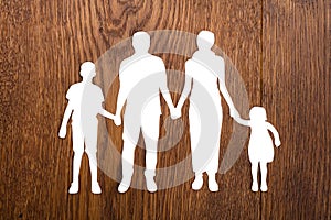 Family Papercut On Wooden Desk