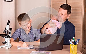 Family parenting and education concept. Father with a newborn ba