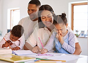 Family, parents help their children with homework and books on desk at their home. Support with writing or reading
