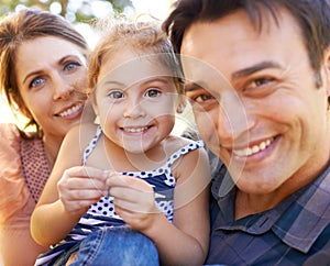 Family, parents and portrait with child in park happy for bonding, healthy relationship and relax on Saturday. Smile