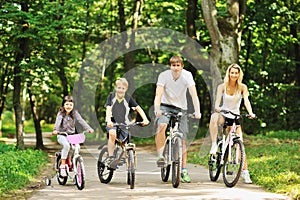 Family in the park on bicycles