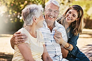 Family, park and woman with elderly parents outdoors, bonding and having fun. Love, support and female with grandma and