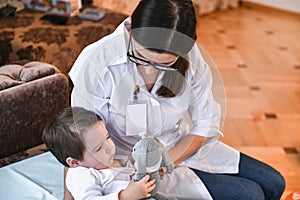 Family pediatrician doctor family doctors home visit to a sick child photo