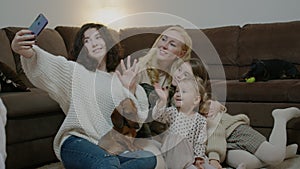 Family people taking selfie with pets and sitting on couch at home room rbbro.