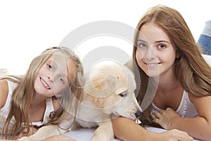 Family pets pup with girls