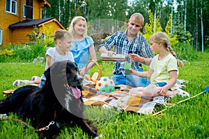 Family picnic with a dog