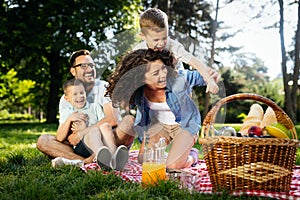 Family picnic outdoors togetherness relaxation happiness concept