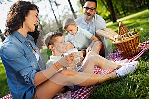 Family picnic outdoors togetherness relaxation happiness concept