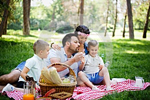 Family picnic outdoors togetherness relaxation happiness concept