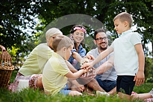 Family picnic outdoors togetherness relaxation happiness concept