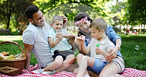 Family picnic outdoors togetherness relaxation happiness concept