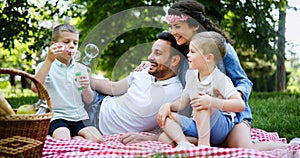 Family picnic outdoors togetherness relaxation happiness concept