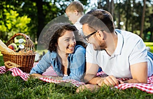 Family picnic outdoors togetherness relaxation happiness concept