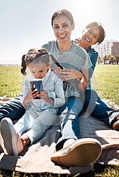 Family, picnic and park with child, mother and grandma sitting together on grass to relax, bond and smile with three