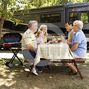 Family at picnic table.