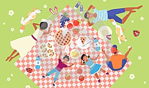 Family picnic, top view of happy mother and father, kids and dog lying on tablecloth