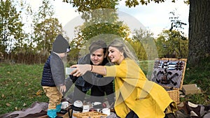 Family picnicking in the park.