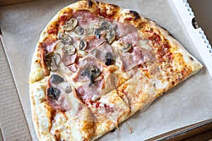 Family pizza, half of oval, consists of two types, margarita, prosciutto fungi. Food delivery concept, takeaway, cuisine, fast