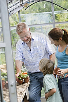 Family Planting In Greenhouse