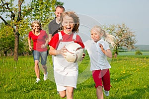 Family playing ballgames