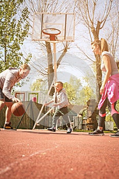 Family playing basketball.