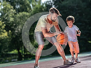 Family playing basketball outdoors