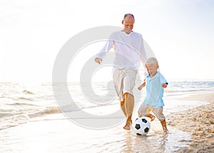 Family playing on the beach