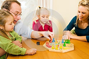 Family playing a board game