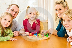 Family playing a board game