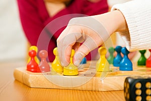 Family playing a board game