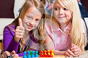 Family playing board game at home