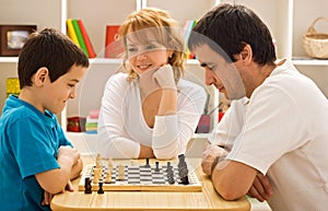 Family playing chess