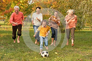 Family playing football photo