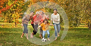 Family playing football photo