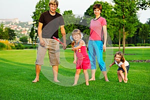 Family playing with frisbee photo