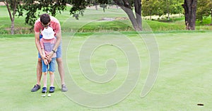 Family playing golf