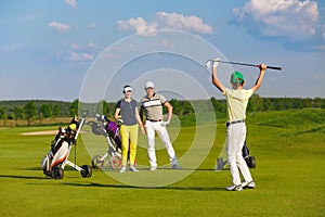 Family playing golf