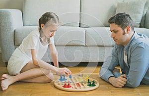Family playing ludo.