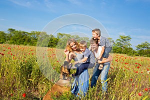 Family playing on the meadow