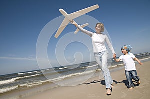 Family playing with plane model