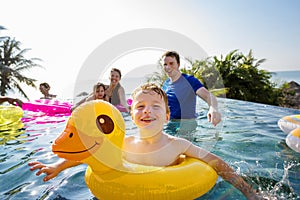 Family playing in a pool