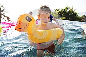 Family playing in a pool