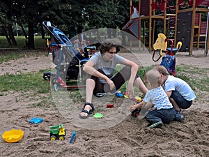 Family playing in the sand