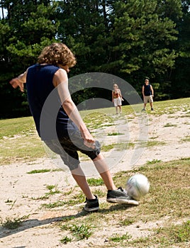 Family playing soccer